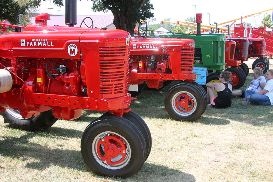 Vintage tractors are displayed.
